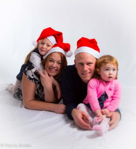 Image of family with christmas hats 