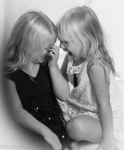 Black and white picture of two girls laughing